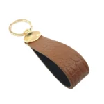 جاکلیدی چرمی مدل بیضی رنگ روکو عسلی با پس زمینه سفید