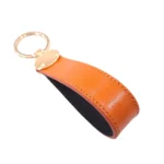 جاکلیدی چرمی مدل بیضی رنگ نارنجی با پس زمینه سفید