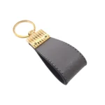 جاکلیدی چرمی مدل کیارا رنگ طوسی با پس زمبنه سفید