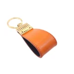 جاکلیدی چرمی مدل کیارا رنگ نارنجی با پس زمبنه سفید