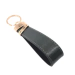 جاکلیدی چرمی مدل لبخند رنگ سبز با پس زمبنه سفید