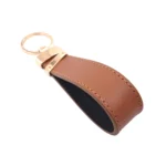 جاکلیدی چرمی مدل لبخند رنگ عسلی با پس زمبنه سفید